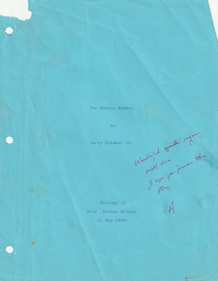 Original blue cover of Jerry Schmeer's 1989 Biology II paper The Wobble Effect, with the instructor's handwritten comments and grade.